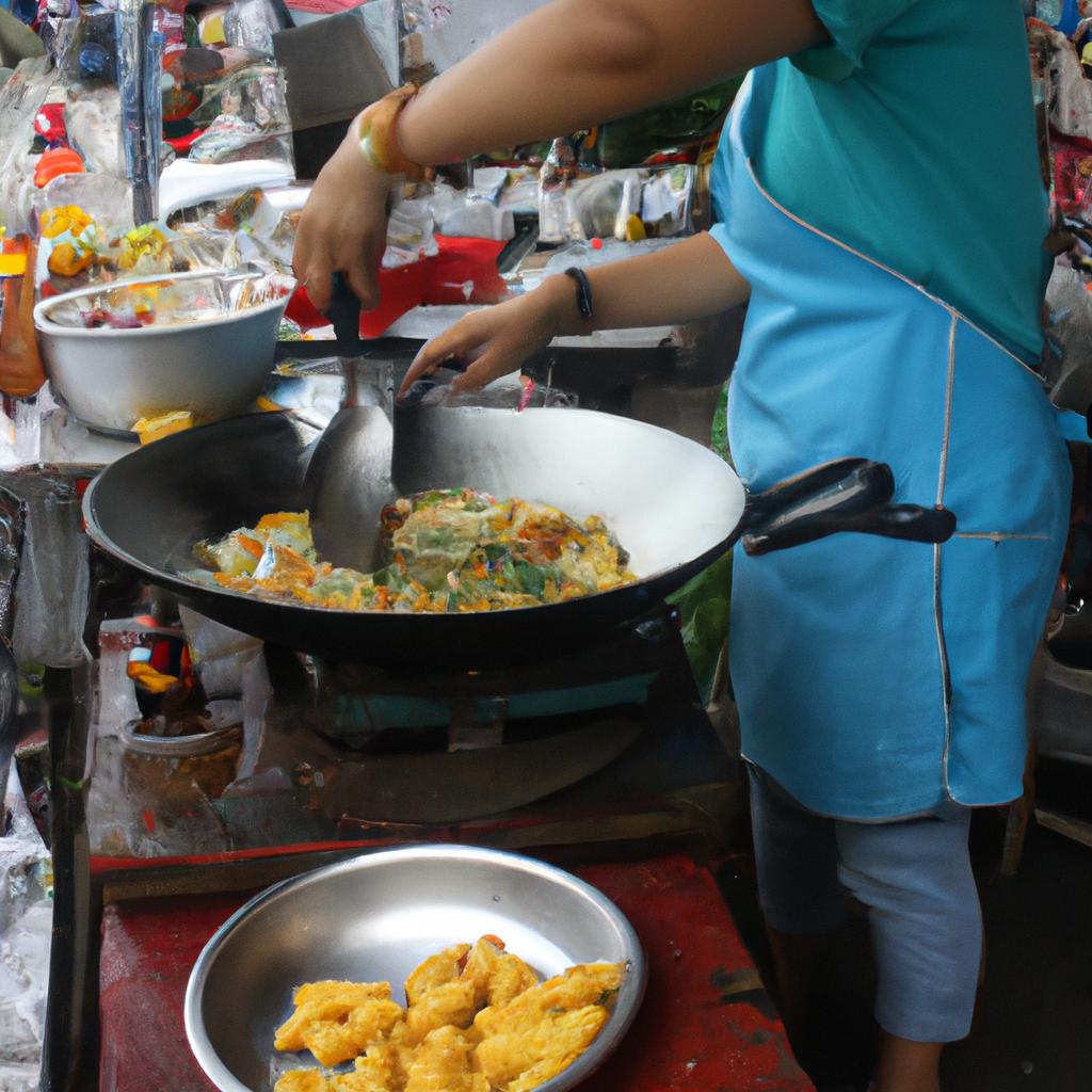 Woman cooking Thai street food