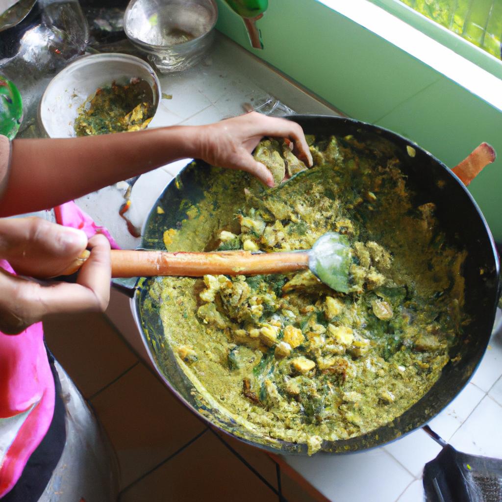 Woman cooking green curry dish
