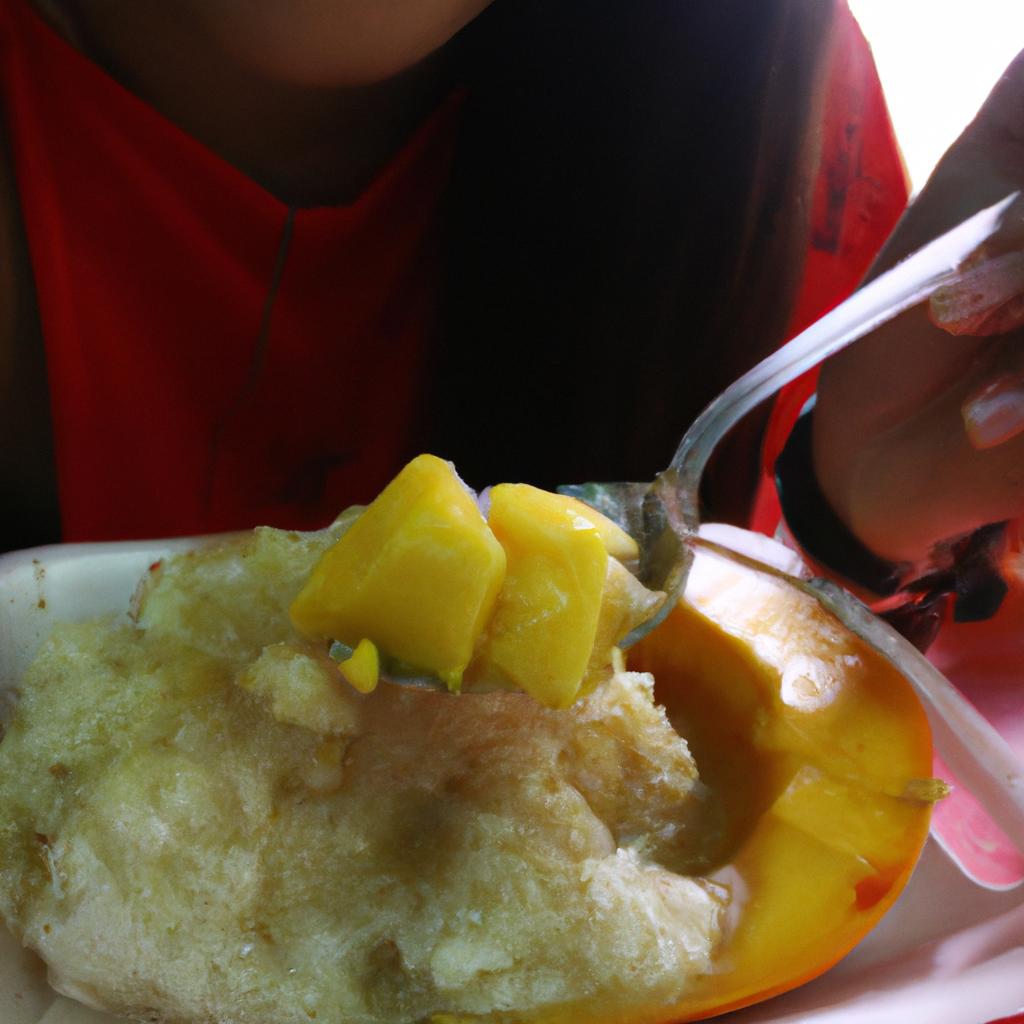 Person eating mango sticky rice