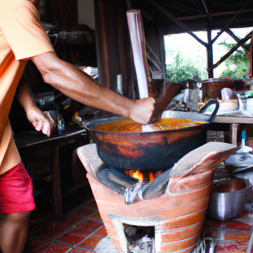 Man cooking traditional Thai dish